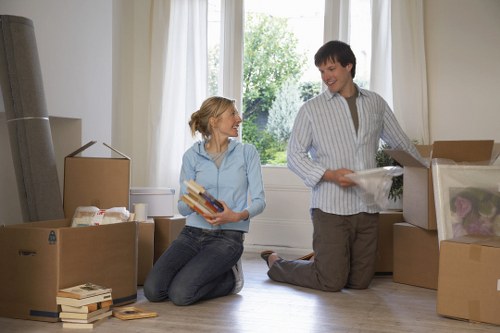 Professional movers loading items for a Purley relocation